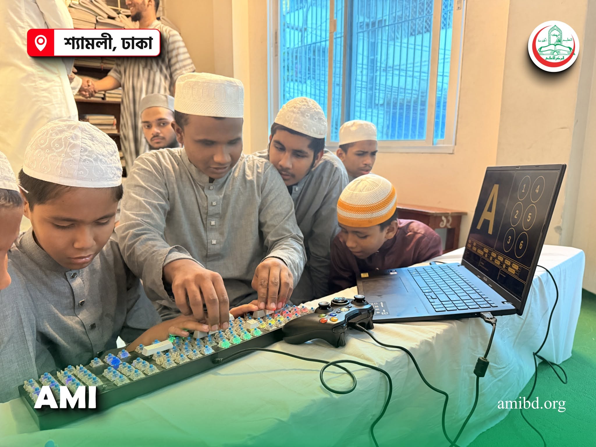Students testing a braille learning keyboard beside a laptop display.